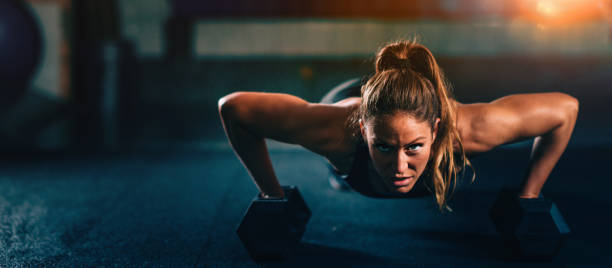 Woman exercising in CrossFit gym