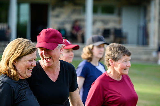Mature women laughing during group fitness practice