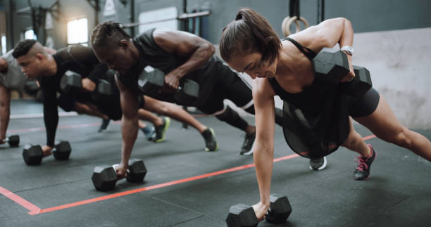 Group of athletes working out together in a gym